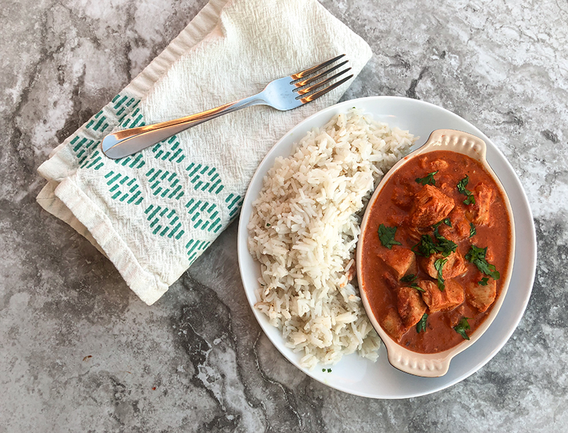 Chicken Tikka Masala with basmati rice and napkin and fork